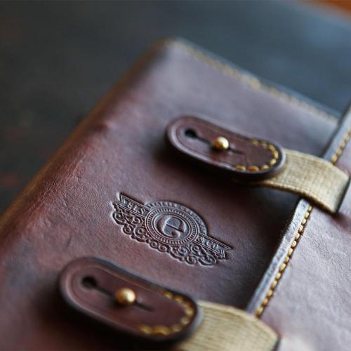 The Johannesburg Journal, brass studs, logo, leather products, canvas strap, yellow stitching